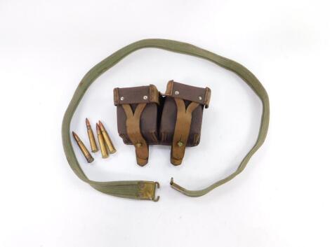 A Russian brown leather two pocket ammunition belt, together with a canvas military belt. (2)