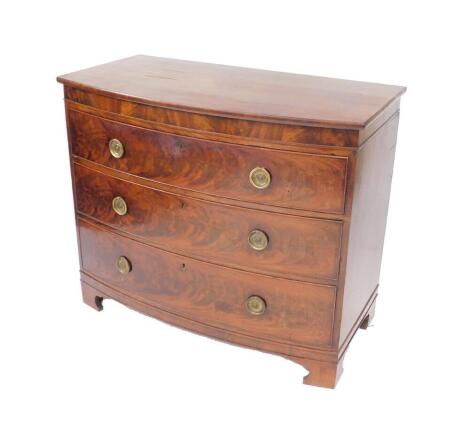 A George III mahogany bow front chest of drawers, with three long graduated drawers raised on bracket feet, 92cm H, 110cm W, 56.5cm D.