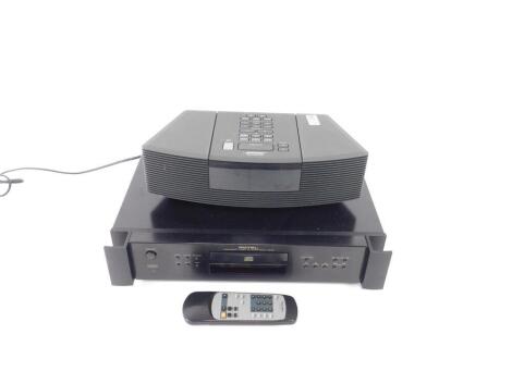 A Rotel compact disk player, RCD-1072, together with a Bose Wave radio and CD player, model AWRC3G, with remote. (2)