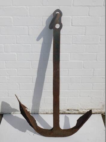 A green painted cast iron anchor, 110cm H.