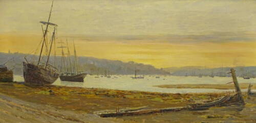 Philip Thomson Gilchrist (1865-1956). The ship graveyard at Falmouth, oil on canvas, signed and titled verso, 36.5cm x 75cm.