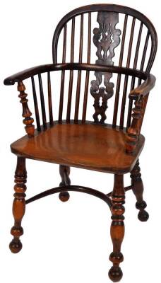 A fine early 19thC yew wood low back Windsor chair, with pierced Christmas tree splat, turned legs and crinoline stretcher.