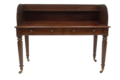 A country house tray top wash stand in the manner of Holland & Sons, with shelved tray top on a moulded platform, with two dummy frieze drawers with mushroom knob handles and turned legs, on brass cup casters, 74cm platform H, 139cm W, 60cm D. Provenance: