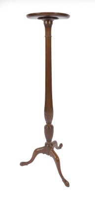 A 19thC mahogany torchere, having circular platform top with raised moulded border and lappet leaf carving and stringing to the slender column upon a tripod base, 146cm H. Provenance: The St Georges Collection, Stamford. To be sold WITHOUT RESERVE.