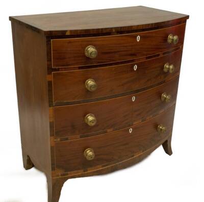 A Regency mahogany bowfront chest, of four graduated drawers with boxwood strung and rosewood crossbanded top, over four drawers with brass circular pressed handles, ivory escutcheons and splay feet, 107cm H, 105cm W, 58cm D. Provenance: The St Georges Co - 2