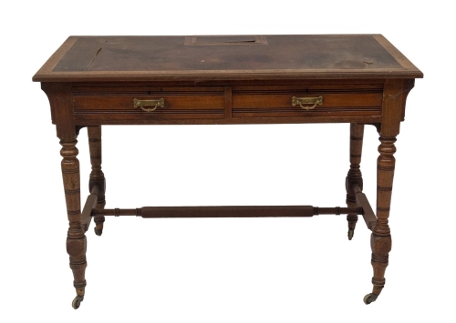 A late 19thC American walnut chamber or writing table by Gillows of Lancaster, having leatherette moulded top with lift compartment for pen tray and ink wells, over two frieze drawers, one stamped GILLOW & CO, LANCASTER, each with aesthetic brass loop han