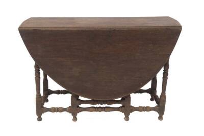 A 17thC walnut gateleg table, with oval drop leaf top, single frieze drawer, baluster turned legs and stretchers, on turned feet, 76cmH, 145cmW,117cm L. Provenance: The St Georges Collection, Stamford. To be sold WITHOUT RESERVE.