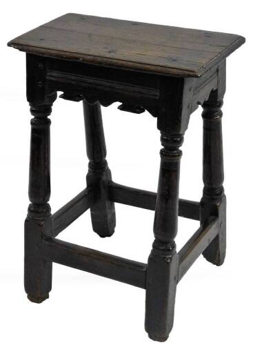 A 17thC oak coffin stool, the rectangular top with a moulded edge above a shaped frieze on turned supports with stretchers, 54cm H, 39cm W, 25cm D.