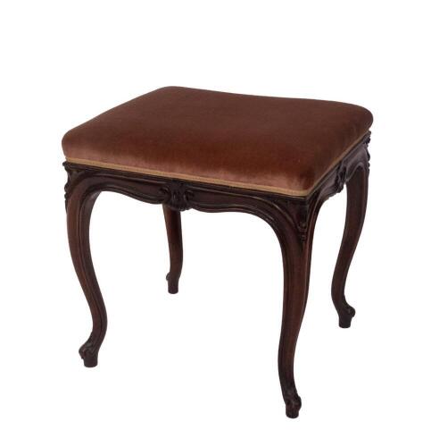 A Victorian rosewood stool, with pink draylon overstuffed seat, scroll frieze with stylised decoration, profiled cabriole legs with leaf scroll and turned feet, 48cm H, 48cm W, 40cm D. Provenance: The St Georges Collection, Stamford. To be sold WITHOUT RE