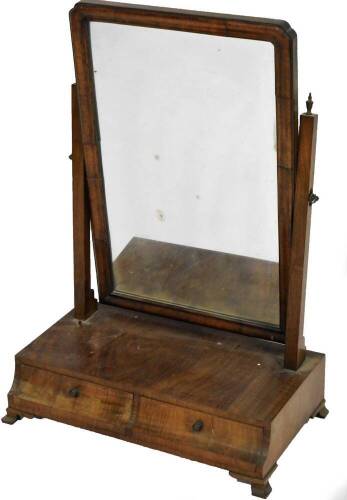 A late 19thC walnut table mirror, the shaped glass flanked by urn topped supports on a platform base, with inverted double drawer front, on bracket feet, 65cm H, 48cm W, 26cm D.