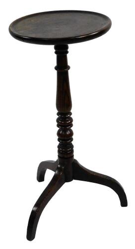 An 18thC walnut and elm candle stand or occasional table, the circular dished top on a turned column and tripod base, 69cm H, 33cm Dia.