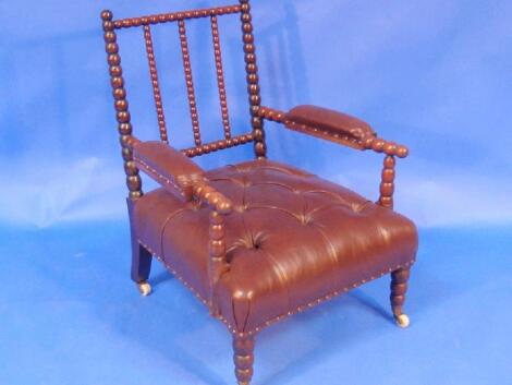 A 19thC bobbin elbow chair