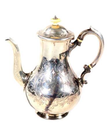 A Victorian silver tea pot, with acanthus scroll handle, engraved decoration, London 1862, 22oz.