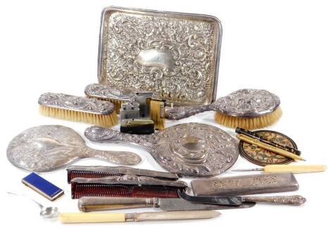 An Edwardian silver tray, of rectangular form, repousée decorated and initialled AB to the centre, Chester 1903, 24cm W, 5oz,, various dressing table accessories, matched dressing table set with hand mirror, clothes brush, another, comb, small quantity of