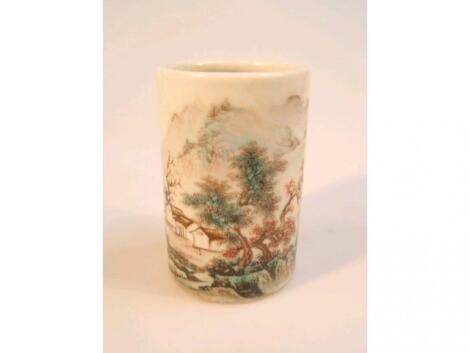 A Chinese cylindrical brush pot hand painted with mountainous landscape