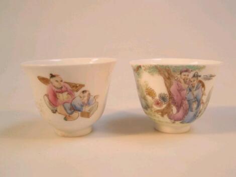 A pair of Chinese porcelain cups with slightly averted rims hand painted