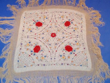 A Chinese silk tablecloth hand embroidered with flower head and trailing