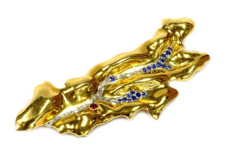 An Asprey & Co abstract brooch, of elongated design set with sapphires, diamonds and a ruby, in gold coloured setting, unmarked, with single pin back, 7cm long overall, 15.9g all in, Asprey & Co Ltd, New Bond Street, London box.