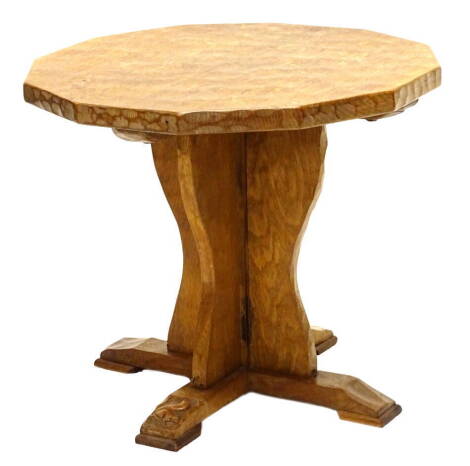 An oak occasional table by Wilf Squirrelman Hutchinson, the octagonal adzed top on trefoil support, with X shaped base, carved with squirrel motif, 50cm H, 59cm W.