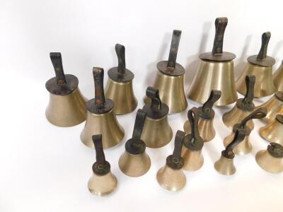 Twenty seven hand bells by J Shaw Son & Company, Leeds Road, Bradford., many with internal hammers, with leather handles indicating the music note. - 3