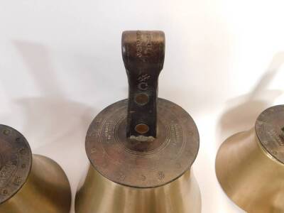 Twenty seven hand bells by J Shaw Son & Company, Leeds Road, Bradford., many with internal hammers, with leather handles indicating the music note. - 4