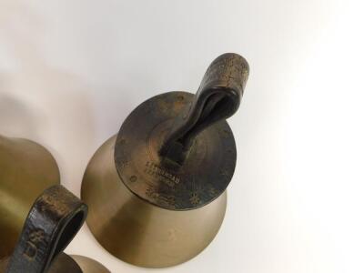 Twenty seven hand bells by J Shaw Son & Company, Leeds Road, Bradford., many with internal hammers, with leather handles indicating the music note. - 5
