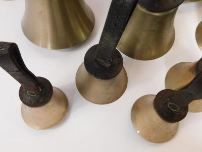 Twenty seven hand bells by J Shaw Son & Company, Leeds Road, Bradford., many with internal hammers, with leather handles indicating the music note. - 6