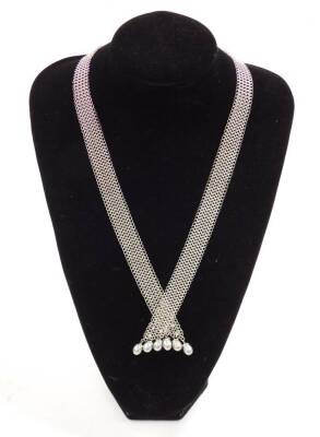 An 18ct white gold chain mail necklace, with grey baroque pearl drops, and set with small diamonds, 82.6g.