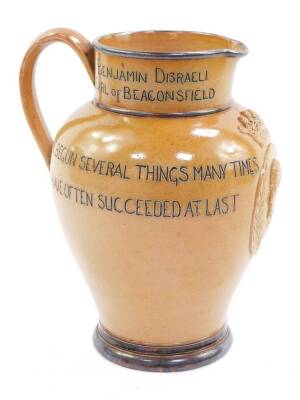 A Doulton Lambeth jug commemorating the Life of Benjamin Disraeli, Earl of Beaconsfield, born Dec 21st 1804, died April 19th 1881, relief moulded centrally with profile of the Prime Minister surrounded by a laurel wreath with Earl's Coronet surmount, 'I h