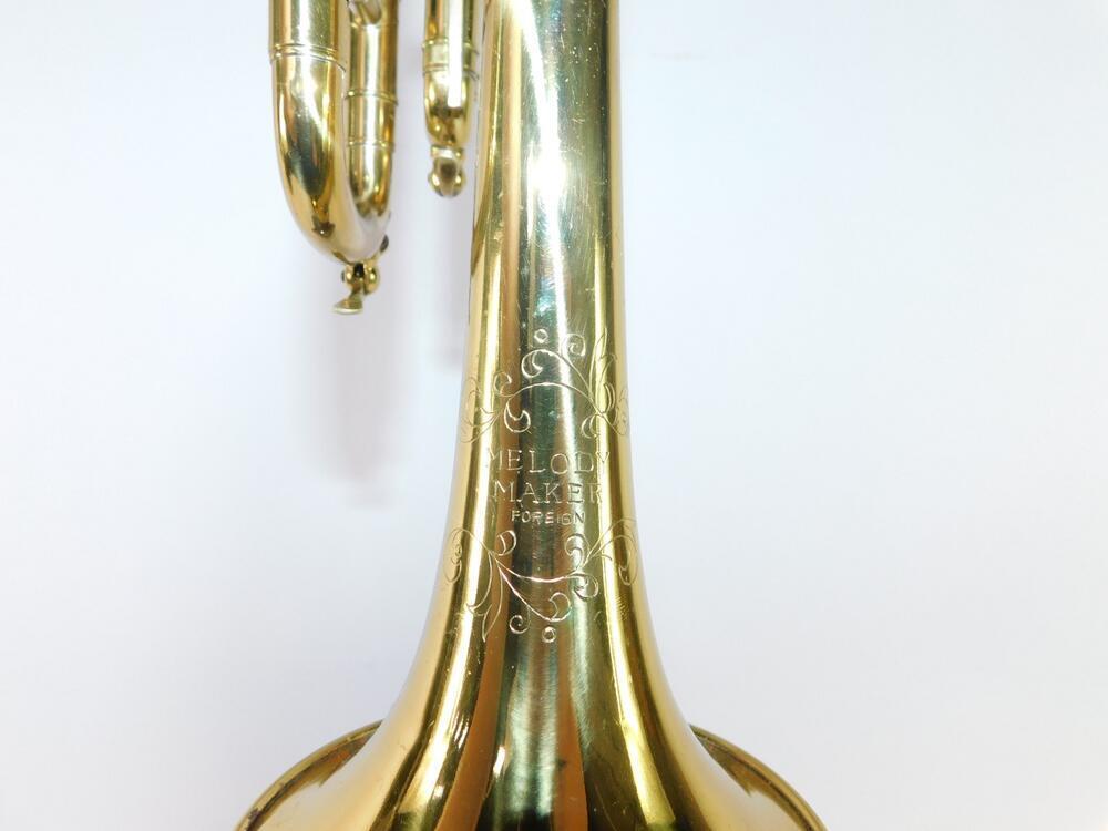 A Melody Maker brass trumpet, cased.