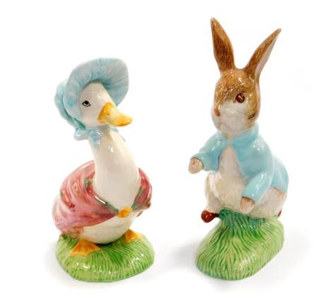 Two Beswick pottery figures of Jemima Puddleduck and Peter Rabbit, 15.5cm H and 17.5cm H respectively.