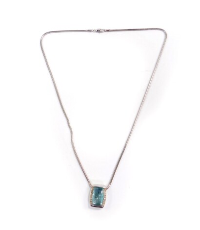 An 18ct white gold aquamarine and diamond pendant, of oblong form, open backed, on a chain, on snap clasp, 14.6g.