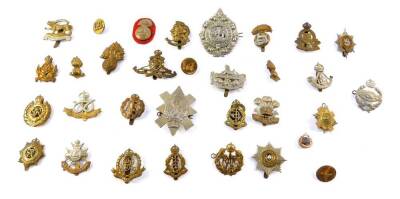 Brass and white metal military cap badges, including South Staffordshire Regiment, Gloucestershire Regiment, Royal Artillery Military Police, and The Argyle and Sutherland Highlanders. (qty)