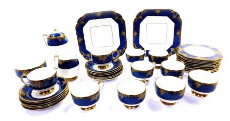 An early 20thC Carlton Ware porcelain part tea service, painted and gilded with flowers against a powder blue ground, pattern no.4884, printed and painted marks, comprising covered hot water jug, cream jug, sugar bowl, pair of bread plates, ten tea cups, 