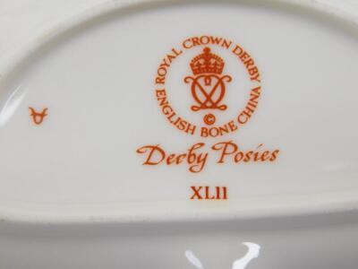 A Royal Crown Derby porcelain part coffee service, decorated in the Derby Posies pattern, comprising coffee pot, cream jug, four coffee cans and saucers, together with a further cream jug, small vase, fan shaped dish and a butter knife. - 3