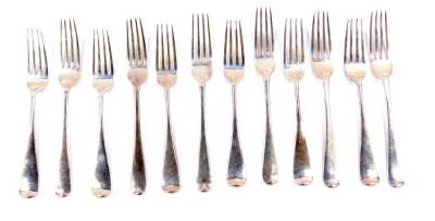 Six Victorian silver Old English pattern table forks, Lambert & Company, London 1893, together with six Victorian dessert forks, Mappin Bros, London 1885, 17.68oz.