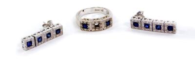 A Zoccai 18ct white gold sapphire and diamond ring, the three square cut sapphires in a surround of diamonds, one sapphire lacking, size O/P, together with a pair of matching four drop sapphire and diamond earrings, 15.6g.