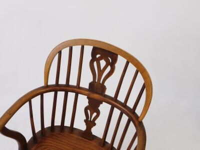 A 19thC yew oak and elm Windsor chair, with vase shaped splat, solid saddle seat, raised on turned legs united by a crinoline stretcher. - 2
