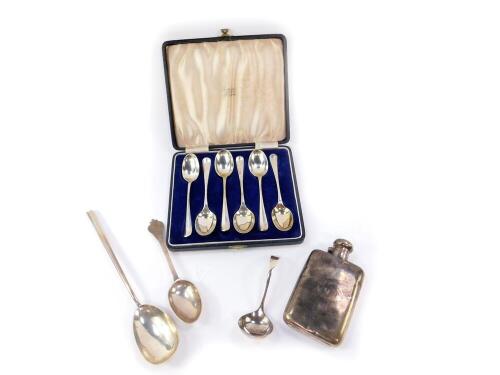 A George V silver hip flask, initial engraved, Birmingham 1916., salad spoon, Birmingham 1918., Edward VII rats tail trefoil spoon, London 1905., cream ladle, Birmingham 1976, and six George V silver teaspoons, cased, Sheffield 1917, 12.35oz.