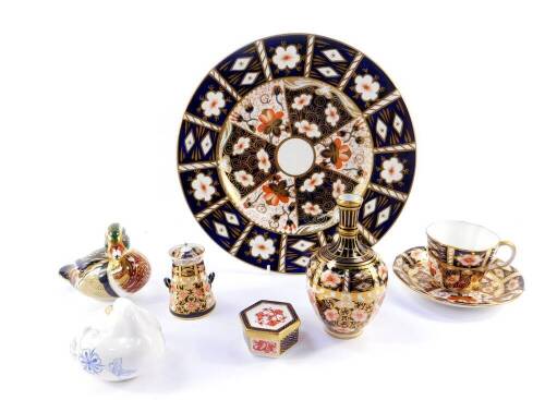 A group of Royal Crown Derby porcelain imari, comprising a vase, tea cup and saucer, miniature milk churn, hexagonal trinket box, and a plate 27.5cm Dia, paperweight modelled as a Carolina Duck, second, and an imari blue duck paperweight. (8).