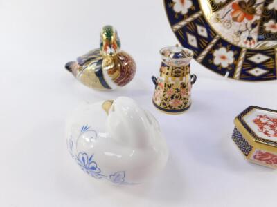 A group of Royal Crown Derby porcelain imari, comprising a vase, tea cup and saucer, miniature milk churn, hexagonal trinket box, and a plate 27.5cm Dia, paperweight modelled as a Carolina Duck, second, and an imari blue duck paperweight. (8). - 2