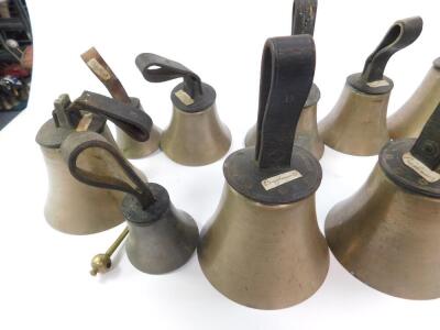 Fourteen hand bells by W Pawson, Leeds, some with hammers, with leather handles, bearing labels from Biggleswade. - 5