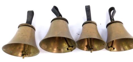 Four hand bells, D E F# and G, with hammers, tooled leather handles.