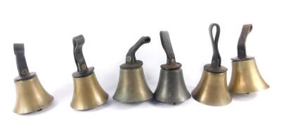 Six hand bells with hammers, one lacking, tooled leather handles.