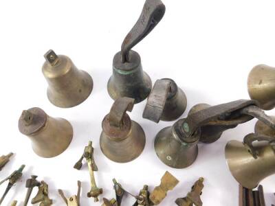 Hand bells, some with hammers and tooled leather handles, together with spare handles and hammers. (qty) - 3