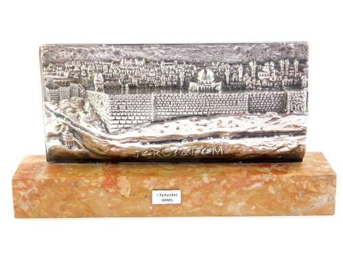 I Yeheskel. A silver high relief sculpture of Jerusalem, raised on a marble rectangular base with artist plate, 22cm W.