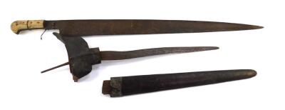 A Middle Eastern straight short sword, with inlaid bone handle, blade 60cm L, and a dagger with a wooden cross guard, wavy blade, with engraved detailing with sheath, blade 30cm L. (2)