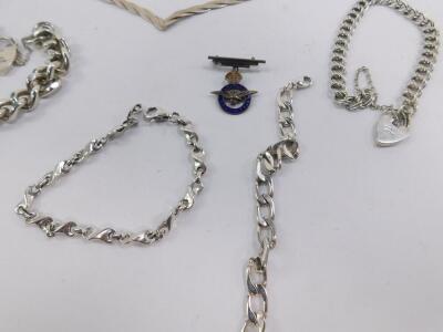 Silver jewellery, including a gate link bracelet, curb link bracelet on a heart shaped padlock clasp, RAF pendant badge, chains, etc, 174.4g. - 2