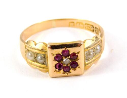 A Victorian 15ct gold seed pearl ruby and diamond ring, in a flower head tiered design, size N, 3.1g.