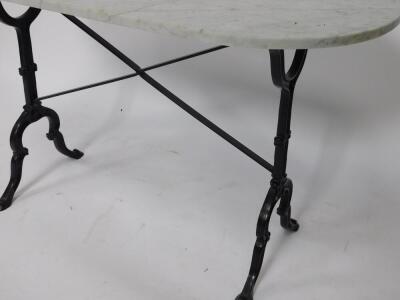 An oval white marble and cast iron table, raised on a shaped supports united by an X frame stretcher, 72cm H, 119cm W, 60cm D. - 3